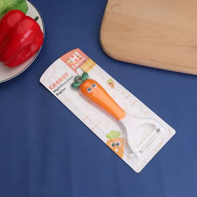 Designová škrabka na zeleninu s vtipným motivem obličeje - mrkev, ředkev, petržel