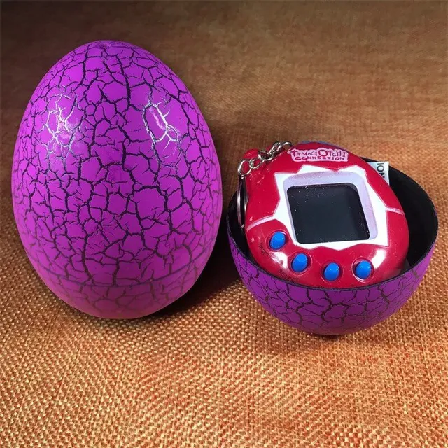 Colored egg with Tamagochi dinosaur - virtual electronic pet - manual digital game