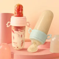 Silicone baby feeding bottle with teaspoon for serving porridge + chewing toy for infants