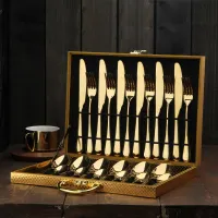 Set of gold cutlery in the trunk