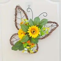 Spring wreath with butterflies and sunflowers on the door