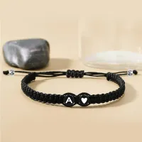 Knitted bracelet with 26 letters to choose from, black and white, with heart beads