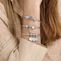 Silver pendants for bracelet with film motif