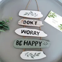 Motivating wooden inscription "Don't worry, be happy"