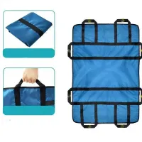 Insoluble bed positioning pad with reinforced handles