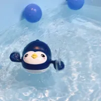 Swimming penguin for bath or swimming pool