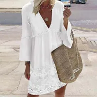 Fresh white mini dress with long sleeves, v-neck and eyelets