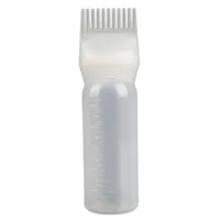 Bottle with hair dye comb