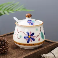 Mignonne pot en céramique pour miel avec cuillère et couvercle