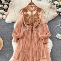 Fashion dress for women with meshed material, trim, fluffy sleeves, seed beads and distinctive 3D flowers