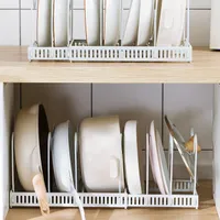 Sofa bed organizer on pots and pans in wardrobe