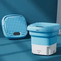 Folding travel washing machine with centrifuge