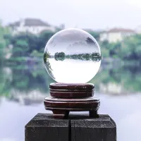 Crystal ball on wooden stand