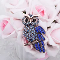 Brooch in the form of an owl made of stones - blue