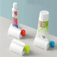 Toothpaste dispenser with holder