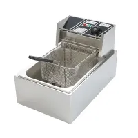 Electric fryer with basket and lid, kitchen fryer on work plate