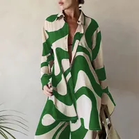 Women's two-piece set in excessive size - abstract striped printing, shirt with long sleeves and collar, trousers with high waist and wide pants