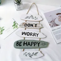 Wooden decorative shields with soothing and encouraging slogans