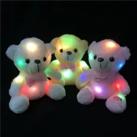 Beautiful glowing teddy bear with bow