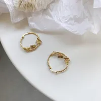 Gold earrings with butterfly