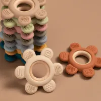 Silicone toy for soothing and chewing for BPA-free children with wooden ring