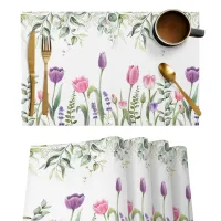 Jemná tkanina nastavená na stôl s tulipánovým motívom