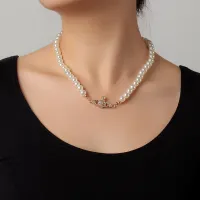 Saturn pearl necklace