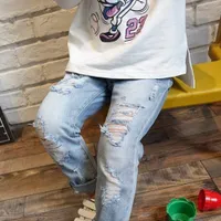 Boy's torn jeans