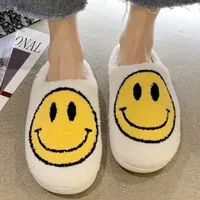 Plush winter slippers with smiley face