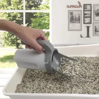 Practical scoop with bag dispenser for quick and easy cleaning of the cat litter tray
