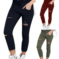 Women's skinny jeans with holes and drawstring