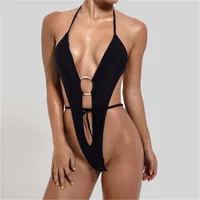 Single-piece swimsuit with deep neckline and gold ring