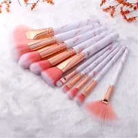 Set of make-up brushes in marble design