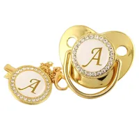 Golden pacifier and clip with letter A