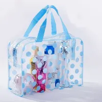 Transparent toiletry bag with polka dot motif for cosmetics and more