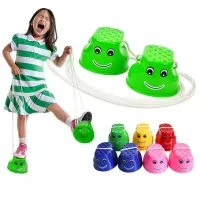 Children's colored plastic stilts with smiley face