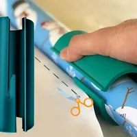 Wrapping paper roll cutter