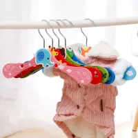 Wooden baby hanger with animal motifs