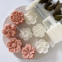 Set for the manufacture of homemade monthly cakes with the shape of cherry blossoms, comprising one form and four stamps