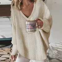 Women's winter knitted sweater with long sleeve and neckline to V