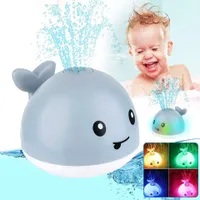 Children's illuminated bath toy with whale motif