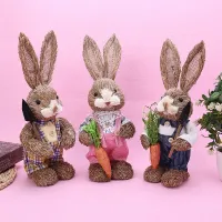 Artificial straw rabbit with carrot - home and garden decoration at Easter