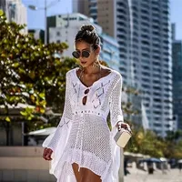 Knitted beach dress with V neckline and long sleeves