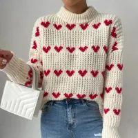 Knitted sweater for women with round neckline, heart pattern and elegant