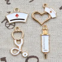 10 pcs of pendants with syringe, stethoscope, heart, nurse hat and drop of oil in gold color, for the manufacture of jewelry