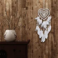 Beautiful heart-shaped dream catcher with feathers and beads