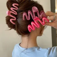 Pince à cheveux ondulée pour femme en différentes couleurs