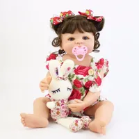 Realistic doll with accessories 55 cm