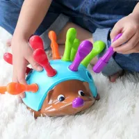 Children's educational toy in the shape of a hedgehog for the development of fine motor skills