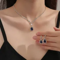 Luxury women's jewelry set with dark blue cut stone - set of necklaces and earrings